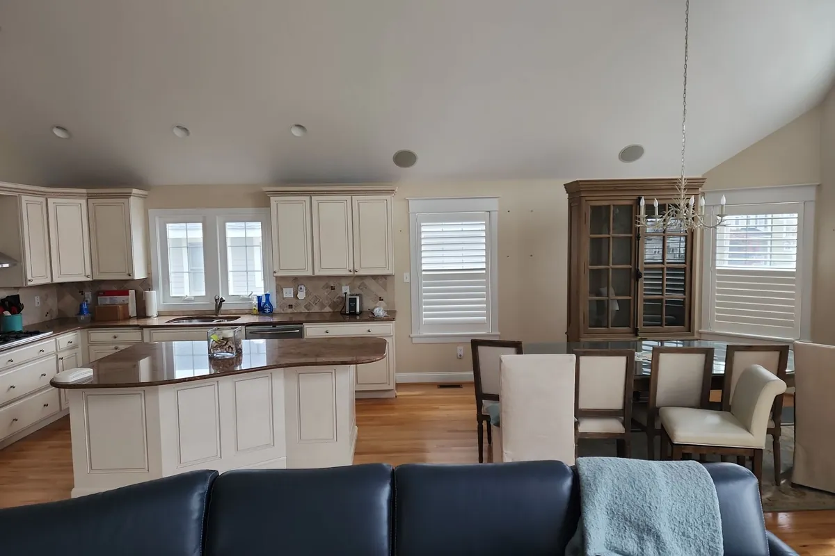 Bright shore-home interior with a vaulted ceiling after repair work